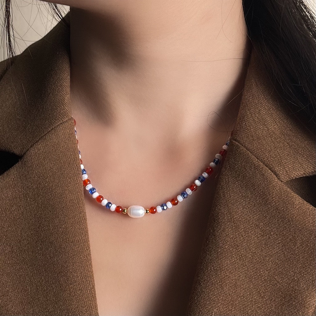Blue and red pearl necklace