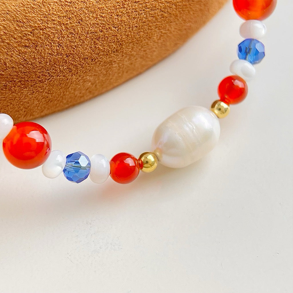 Blue and red pearl necklace
